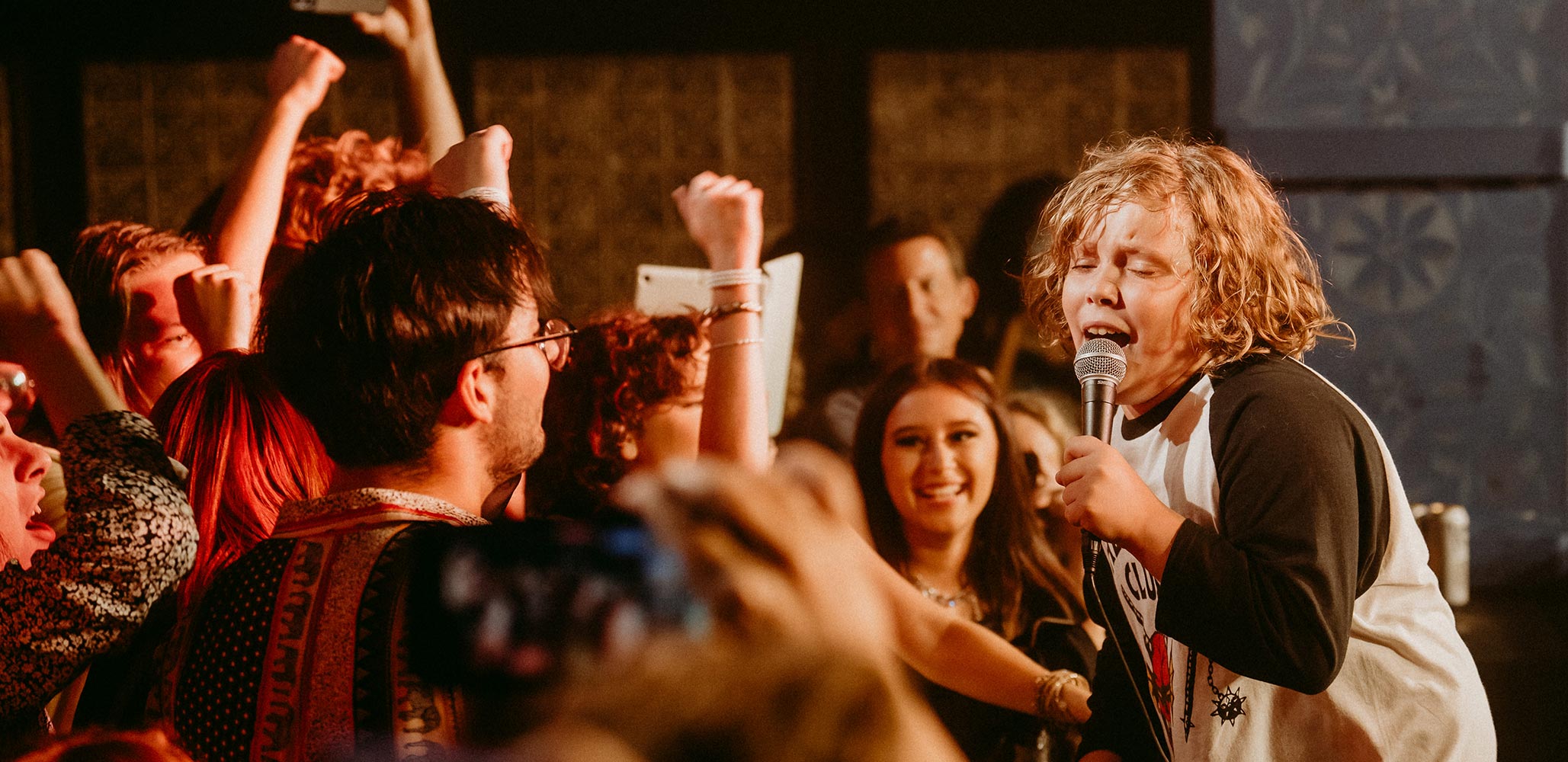 A School of Rock student performing for the crowd