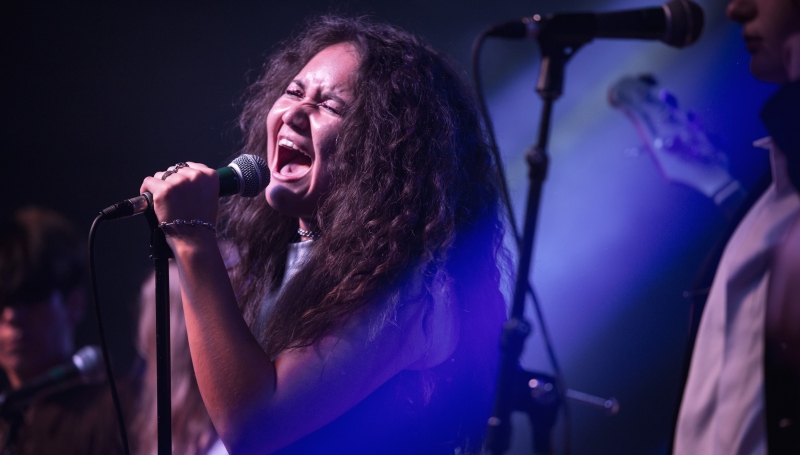 School of Rock Students Performing on Stage